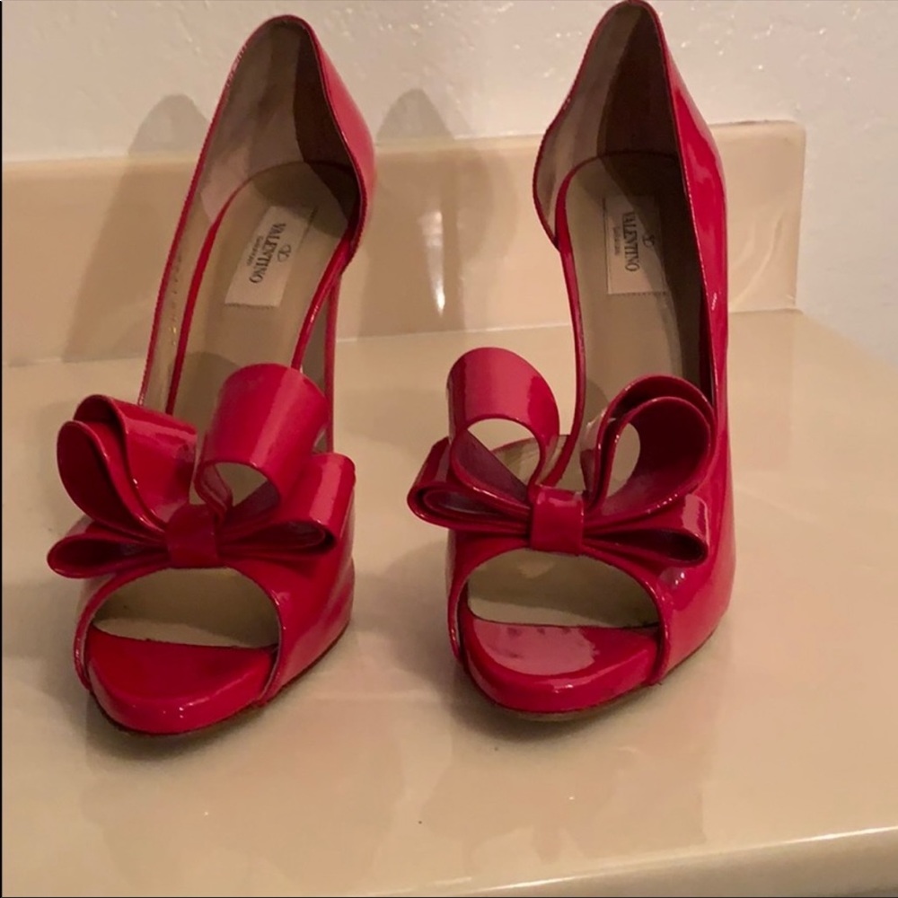 Valentino D’orsay patent leather bow pumps.